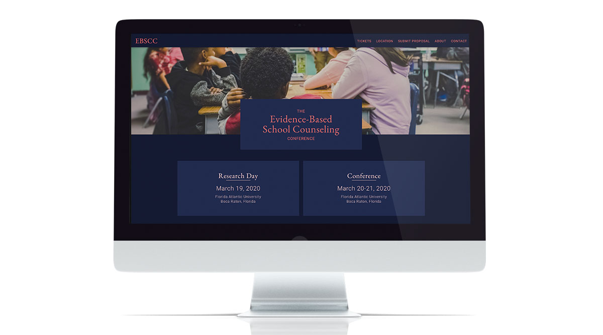desktop computer with the Evidence Based School Counseling website visible on the screen